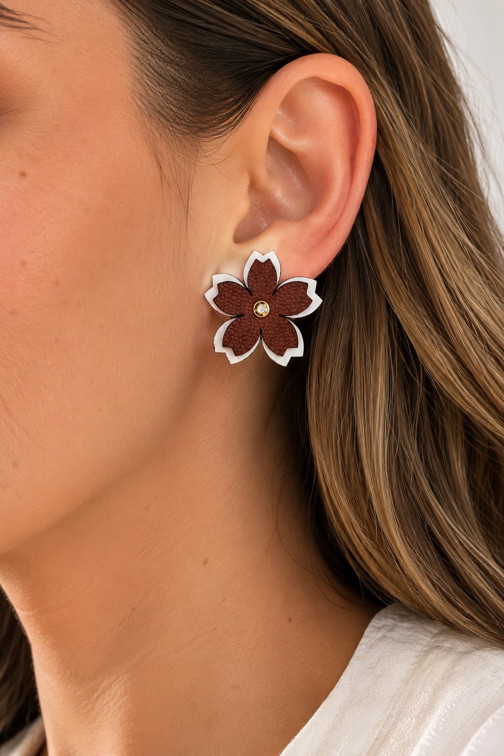 ARETES CUERO